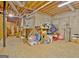 Unfinished basement used for storage; concrete walls and floors with exposed utilities at 40 High St, Sharpsburg, GA 30277