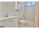 Bright bathroom features a shower-tub combination and vanity with integrated sink at 40 High St, Sharpsburg, GA 30277