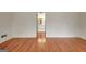 Spacious bedroom with hardwood floors and doorway into bathroom at 40 High St, Sharpsburg, GA 30277