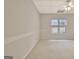 Spacious carpeted bedroom with neutral walls and natural light from a window at 40 High St, Sharpsburg, GA 30277