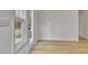 Open bonus room with wood floor and door to the backyard at 40 High St, Sharpsburg, GA 30277