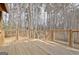 Expansive wooden deck featuring metal-wire railing backing up to trees at 40 High St, Sharpsburg, GA 30277