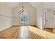 Traditional dining room with hardwood floors, chandelier, and decorative leaded glass window at 40 High St, Sharpsburg, GA 30277