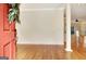 Bright foyer with hardwood floors viewed from front door with wreath, flowing to spacious living areas at 40 High St, Sharpsburg, GA 30277