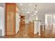 Open-concept kitchen with hardwood floors, island, and wood cabinetry at 40 High St, Sharpsburg, GA 30277