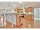 Kitchen with wood cabinets, granite countertops, and stainless steel appliances at 40 High St, Sharpsburg, GA 30277
