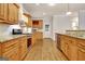 Bright kitchen with stainless steel appliances, wood cabinets, and granite countertops at 40 High St, Sharpsburg, GA 30277