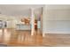 Open-concept living space with hardwood floors leading to the kitchen and dining areas at 40 High St, Sharpsburg, GA 30277