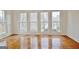 Bright living room with hardwood floors, large windows, and lots of natural light at 40 High St, Sharpsburg, GA 30277