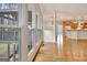 Bright living room with hardwood floors transitions seamlessly into an open kitchen with stainless steel appliances at 40 High St, Sharpsburg, GA 30277