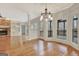 Open living room with fireplace, built-in shelving, hardwood floors, and lots of natural light at 40 High St, Sharpsburg, GA 30277