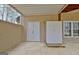 Covered patio features access doors and ample storage providing functional outdoor space at 40 High St, Sharpsburg, GA 30277