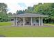 Community pavilion with stone fireplace and picnic tables providing an excellent gathering space at 40 High St, Sharpsburg, GA 30277