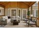 Outdoor screened-in porch features comfortable seating and a serene outdoor view at 40 High St, Sharpsburg, GA 30277