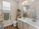 Bright bathroom featuring a double vanity, a shower/tub combo, and handicap bars at 3226 Puritan Way, Mcdonough, GA 30252