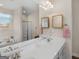 Bright bathroom featuring double sink vanity, tile floors, and a soaking tub at 3226 Puritan Way, Mcdonough, GA 30252