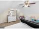 Bright upstairs bedroom featuring a dresser and an office area at 3226 Puritan Way, Mcdonough, GA 30252
