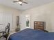 Cozy bedroom featuring a bed with blue linens, a chest of drawers and a view of another room at 3226 Puritan Way, Mcdonough, GA 30252