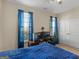 Comfortable bedroom with a window view, an office desk and a modern ceiling fan at 3226 Puritan Way, Mcdonough, GA 30252