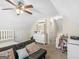 Cozy bedroom features a ceiling fan, dresser and carpeted floors at 3226 Puritan Way, Mcdonough, GA 30252