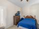 Bedroom features a wood bed frame, ceiling fan, and classic bedroom decor at 3226 Puritan Way, Mcdonough, GA 30252