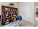 Inviting bedroom featuring a large bookshelf and a view to the next room at 3226 Puritan Way, Mcdonough, GA 30252