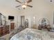 Comfortable bedroom with vaulted ceiling, ceiling fan, and view to two doorways at 3226 Puritan Way, Mcdonough, GA 30252