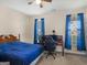 Bedroom features a wood bed frame, ceiling fan, and lots of natural light at 3226 Puritan Way, Mcdonough, GA 30252