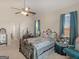 Cozy bedroom with vaulted ceiling, ceiling fan, and large windows with curtains at 3226 Puritan Way, Mcdonough, GA 30252