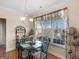 Sunlit breakfast nook features large windows and charming decor, perfect for enjoying morning meals at 3226 Puritan Way, Mcdonough, GA 30252