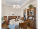 Formal dining room features elegant chandelier, hardwood floors, and vintage furniture at 3226 Puritan Way, Mcdonough, GA 30252