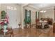 Inviting dining area with hardwood floors, a chandelier, and a decorative rug under the wooden table at 3226 Puritan Way, Mcdonough, GA 30252