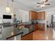 Stylish kitchen featuring sleek granite countertops, stainless steel appliances, and an eat-in breakfast bar at 3226 Puritan Way, Mcdonough, GA 30252