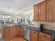 Contemporary kitchen featuring granite counters, stainless steel appliances, and light wooden cabinetry at 3226 Puritan Way, Mcdonough, GA 30252