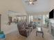 Open living area featuring a fireplace, access to outdoor patio, and smooth transition to the kitchen space at 3226 Puritan Way, Mcdonough, GA 30252