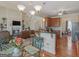 Open-concept living space featuring a kitchen, breakfast nook, and living room with fireplace, ideal for modern living at 3226 Puritan Way, Mcdonough, GA 30252