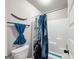 Bathroom with blue shower curtain and matching hand towel at 412 Guildhouse Dr # 38, Mcdonough, GA 30252