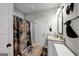 Bathroom with granite countertop and decorative shower curtain at 412 Guildhouse Dr # 38, Mcdonough, GA 30252