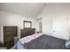 Cozy bedroom featuring neutral walls, a dresser, and a comfortable-looking bed at 412 Guildhouse Dr # 38, Mcdonough, GA 30252