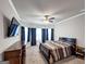 Bedroom with a ceiling fan, dark wood furniture, and natural light at 412 Guildhouse Dr # 38, Mcdonough, GA 30252