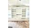 Bedroom closet with custom shelves and hanging space at 412 Guildhouse Dr # 38, Mcdonough, GA 30252