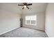 Neutral bedroom with ceiling fan and blinds on the window at 412 Guildhouse Dr # 38, Mcdonough, GA 30252