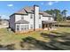 Rear exterior elevation showing a covered patio and well manicured lawn at 412 Guildhouse Dr # 38, Mcdonough, GA 30252