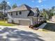 Side exterior elevation showing a brick and siding house with an attached garage at 412 Guildhouse Dr # 38, Mcdonough, GA 30252