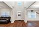 Bright foyer with hardwood floors, high ceilings, white trim, and natural light from window at 412 Guildhouse Dr # 38, Mcdonough, GA 30252