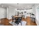 Eat-in kitchen with stainless steel appliances, white cabinets, and an island with barstool seating at 412 Guildhouse Dr # 38, Mcdonough, GA 30252