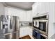 Spacious kitchen featuring stainless steel refrigerator and double oven at 412 Guildhouse Dr # 38, Mcdonough, GA 30252