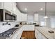 Open kitchen with a gas range, and an island with granite countertops at 412 Guildhouse Dr # 38, Mcdonough, GA 30252