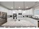 Updated kitchen showcasing white cabinets, stainless steel appliances, and a granite island with barstool seating at 412 Guildhouse Dr # 38, Mcdonough, GA 30252