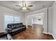 Inviting living room with hardwood floors, crown molding, and connected spaces at 412 Guildhouse Dr # 38, Mcdonough, GA 30252